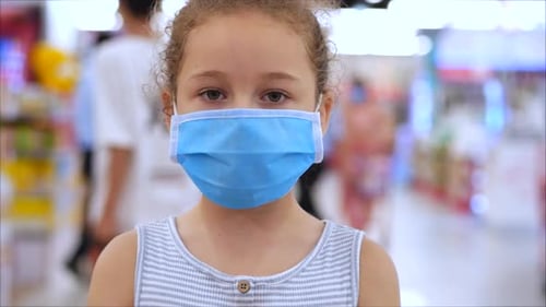Child Wearing Protective Mask Shopping