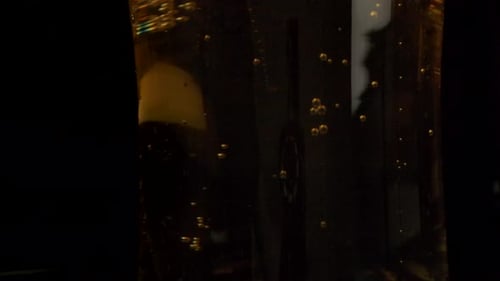 Champagne Being Poured into a Glass with Bubbles