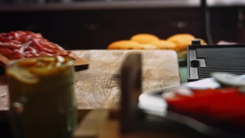 Meat Placed onto a Cutting Board to Prepare Food