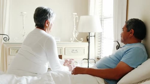 Loving Senior Couple Taking Medication at Home