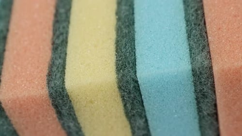 Close-up of colorful dish sponges slow pan 4K video