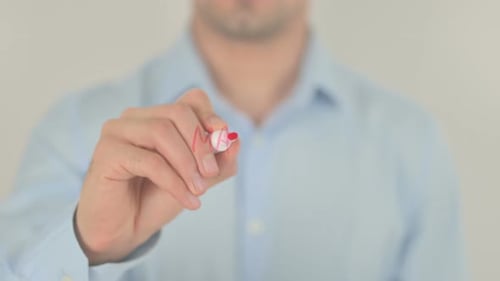 Writing Marketing Ideas on Clear Surface with Marker