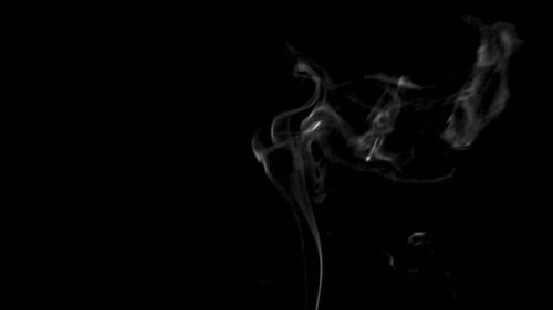 Wispy Smoke Against Black Background