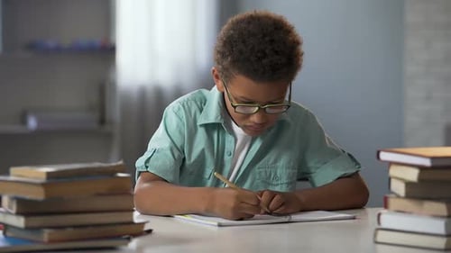 Focused Student Completing Homework at a Desk