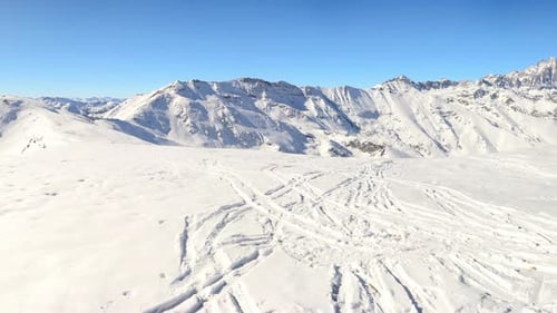 Panorama on snow capped mountain peaks and ridges of the majestic Alps in winter season