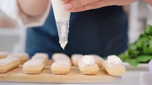 Decorating Delicious Desserts With Creamy White Icing