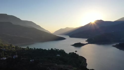 Sunset Over the River in the Mountains Filmed on a Drone