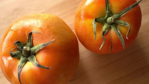 Two Fresh Tomatoes on Wooden Table