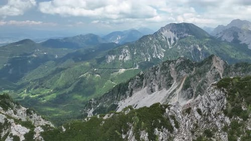 Scenic Mountain Range Aerial View on Partly Cloudy Day