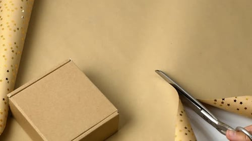 Hand Cutting Wrapping Paper with Scissors