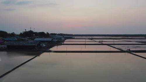 Aerial top view of natural sea salt ponds. Farm field outdoor. Material in traditional industry