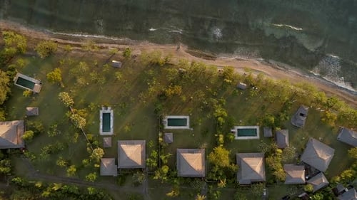 Aerial view above of luxury bungalows, Bali island, Indonesia.
