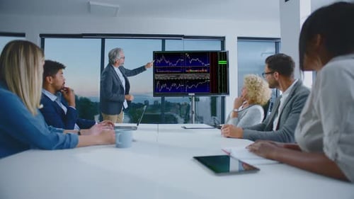 Adults Attend Corporate Data Presentation in Conference Room