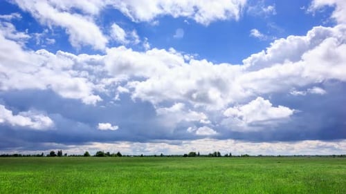 Clouds Moving Over Green Field