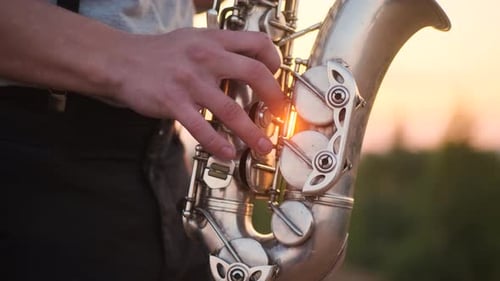 Close Up Silver Sax Play By Bearded Musician in Gray Shirt Performs His Part on Beautiful Shiny