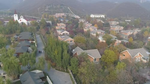 Aerial view of expensive villas in countryside suburb of Beijing during foggy day