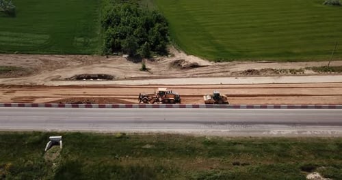 Road Construction Site with Machinery, Bulldozer, Excavation From Above. Video, Aerial View