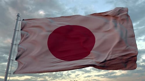 Japanese Flag Waving Proudly in a Cloudy Sky