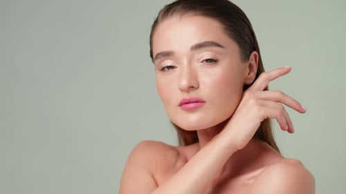 Woman with Slicked Hair and Pink Lips Posing