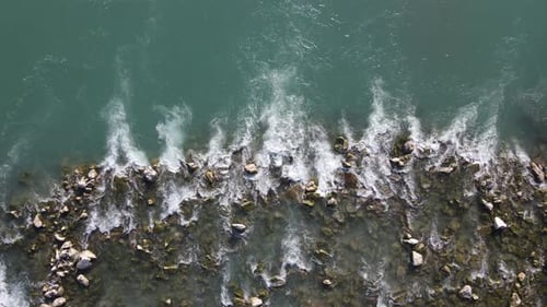 Water Flow Between Stones