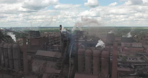 Epic Aerial of Pipes with White Smoke Emission. Plant Pipes Pollute Atmosphere. Industrial Factory