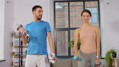 Happy Couple Exercising at Home