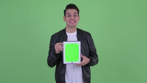 Young Adult Holding Tablet With Chroma Key Screen