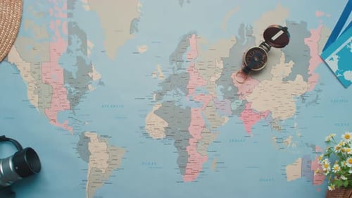Overhead of World Map and Travel Accessories