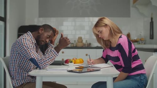Man and Woman Collaborating on Task