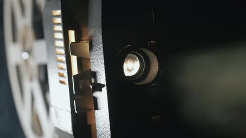 Front View of an Old-fashioned Antique Super 8Mm Film Projector, Projecting a Beam of Light in a