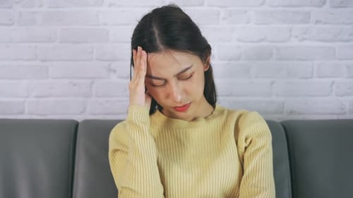 Young Woman with a Severe Headache