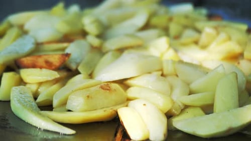 Close Up of Potatoes Frying