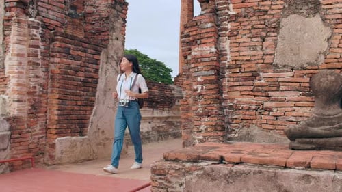 Japanese backpacker female enjoy her journey at amazing landmark in traditional city.