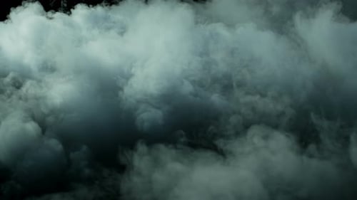Swirling Blue Tinted Smoke Against Black Background