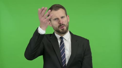 Frustrated Young Businessman Doing Shouting Against Chroma Key