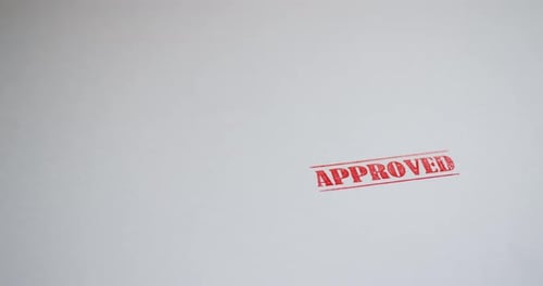 Red APPROVED Stamp on White Paper