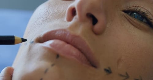 Woman Receives Cosmetic Markings on Face