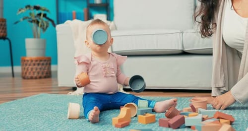 Adorable Baby Playing with Stacking Toy Blocks
