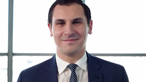 Professional Man in Suit Smiling in Office