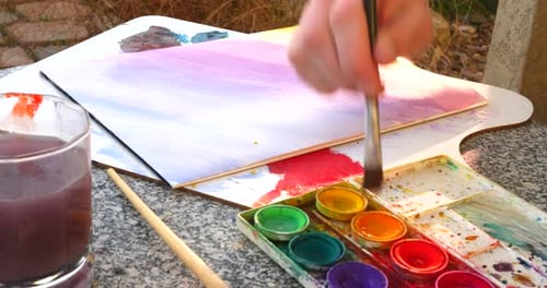 Close Up Hand Painting With Watercolors