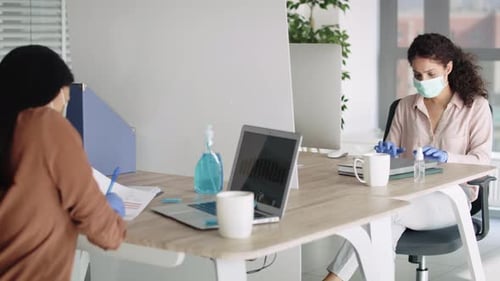 Video of keeping the rules social distance in the office staff. Shot with RED helium camera in 8K.