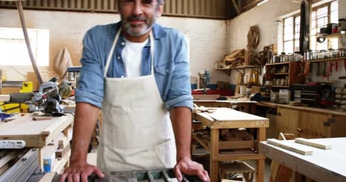 Carpenter smiling for camera