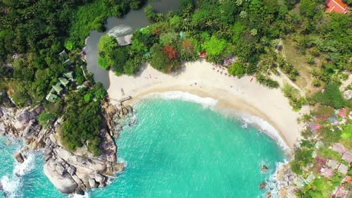 Wide angle fly over clean view of a white sand paradise beach and aqua blue ocean background in hi r