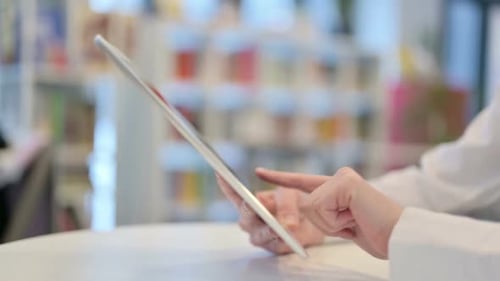 Woman Hands Typing on Tablet Close Up Side View