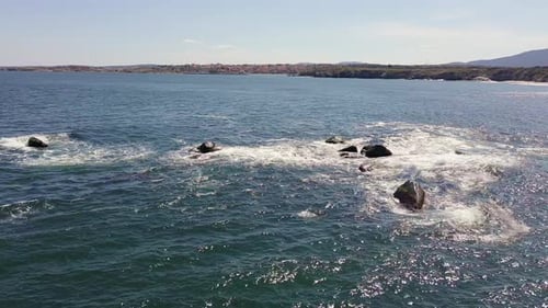 Aerial View of a Stone Ledge in the Black Sea Under a Clear Sky on a Sunny Day