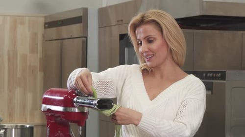 Woman Cuts Vegetable Noodles Using Kitchen Machine