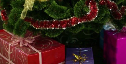 Christmas Tree Ornaments and Shiny Wrapped Gifts