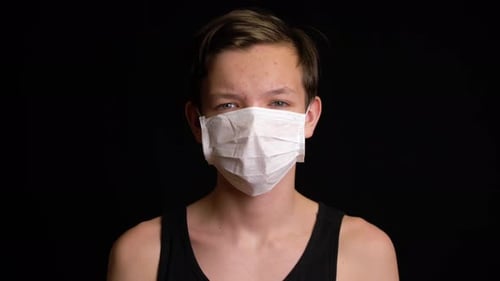 Boy Feeling Sick and Wearing Mask