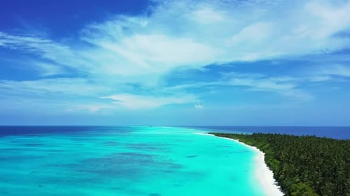 Aerial flying over scenery of marine coastline beach lifestyle by shallow ocean with clean sand back