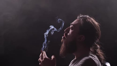 Bearded Man Exhales Smoke Rings Bearded Man Exhales Smoke Rings